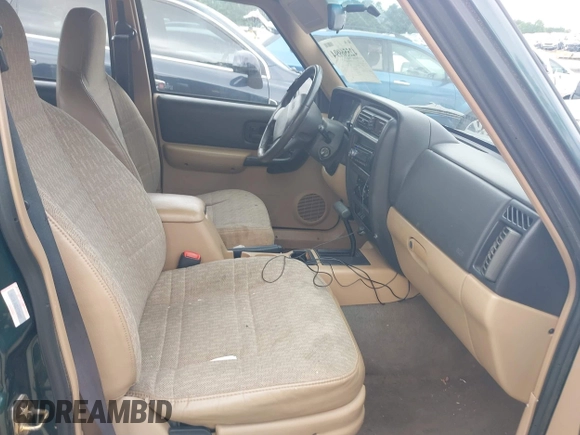 2000 Jeep Cherokee z VIN 1J4FT48S4YL265734, wystawiony jako IAAI lot #42556994 z przebiegiem 228 162 mil mil oraz . Historia ofert i sprzedaży dostępna na DreamBid. Obrazek 5.