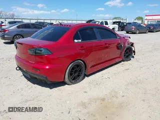 2008 Mitsubishi Lancer Evolution GSR with VIN JA3AW86V38U050561, listed as a IAAI auction lot 41879629 with 104,905 mi miles. Bid and sale history available at carsss.com. Image 4.