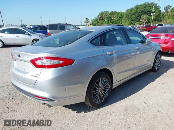 2013 Ford Fusion SE Hybrid with VIN 3FA6P0LU6DR127108, listed as a IAAI auction lot 42023529 with 250,057 mi miles. Bid and sale history available at carsss.com. Image 4.
