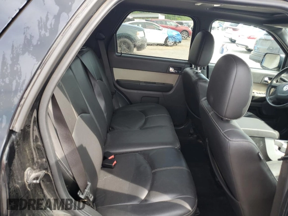 2009 Mercury Mariner Premier z VIN 4M2CU97G29KJ15705, wystawiony jako Copart lot #58233215 z przebiegiem 129 589 mil mil oraz Szkoda całkowita • Salvage title. Historia ofert i sprzedaży dostępna na DreamBid. Obrazek 10.