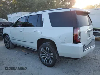 2019 GMC Yukon Denali with VIN 1GKS1CKJ8KR353280, listed as a Copart auction lot 77316454 with 74,476 mi miles and Salvage Title. Bid and sale history available at carsss.com. Image 2.