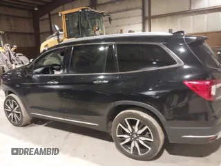 2020 Honda Pilot Touring 7-Passenger with VIN 5FNYF6H63LB032301, listed as a IAAI auction lot 38419333 with 50,433 mi miles and . Bid and sale history available at carsss.com. Image 15.