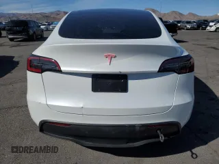 2025 Tesla Model Y Long Range with VIN 7SAYGDED2SA373756, listed as a Copart auction lot 49866835 with 3,318 mi miles and Salvage Title. Bid and sale history available at DreamBid. Image 6.