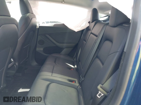 2023 Tesla Model Y Long Range with VIN 7SAYGDEE7PF702051, listed as a IAAI auction lot 42074182 with 50,473 mi miles and . Bid and sale history available at DreamBid. Image 8.