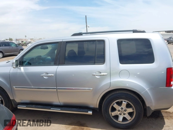 2011 Honda Pilot Touring z VIN 5FNYF3H90BB006634, wystawiony jako IAAI lot #42388390 z przebiegiem 218 475 mil mil oraz . Historia ofert i sprzedaży dostępna na DreamBid. Obrazek 14.