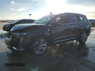 2023 Cadillac XT6 FWD Premium Luxury with VIN 1GYKPCRS6PZ127331, listed as a Copart auction lot 88802755 with 47,796 mi miles and Salvage Title. Bid and sale history available at carsss.com. Image 1.