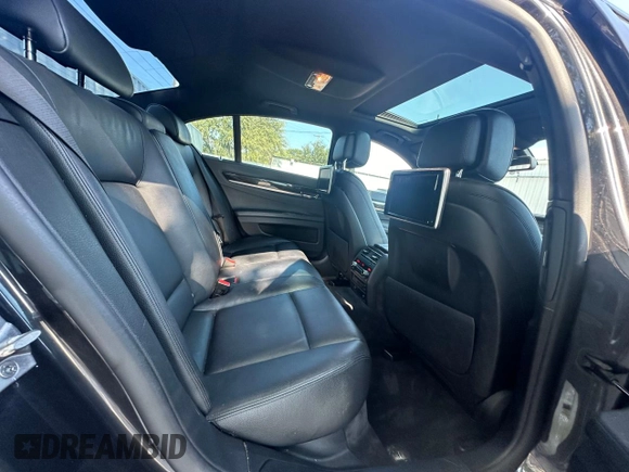 2013 BMW 7 Series 740i with VIN WBAYA6C55DC995225, listed as a Copart auction lot 76207974 with 126,648 mi miles and Clean Title. Bid and sale history available at carsss.com. Image 6.