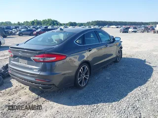 2020 Ford Fusion Titanium with VIN 3FA6P0K91LR175109, listed as a IAAI auction lot 42267532 with 75,000 mi miles and . Bid and sale history available at DreamBid. Image 4.