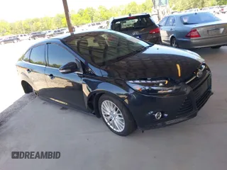 2013 Ford Focus Titanium with VIN 1FADP3J20DL143491, listed as a IAAI auction lot 42034388 with 194,388 mi miles and . Bid and sale history available at carsss.com. Image 1.