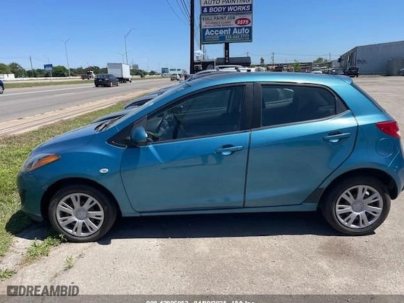 2011 Mazda Mazda2 Sport with VIN JM1DE1HY7B0116561, listed as a IAAI auction lot 42006952 with 139,369 mi miles. Bid and sale history available at carsss.com. Image 12.