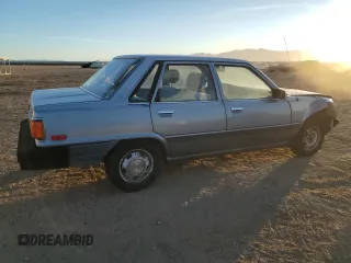 1986 Toyota Camry z VIN JT2SV12E9G0477991, wystawiony jako Copart lot #85531214 z przebiegiem 297 033 mil mil oraz Czysty tytuł • Clean title. Historia ofert i sprzedaży dostępna na DreamBid. Obrazek 3.
