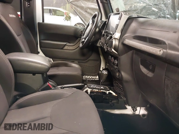 2017 Jeep Wrangler Unlimited Sport with VIN 1C4BJWDG9HL565213, listed as a IAAI auction lot 40999452 with 50,586 mi miles. Bid and sale history available at carsss.com. Image 5.