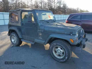 2002 Jeep Wrangler Sahara z VIN 1J4FA59S12P757177, wystawiony jako Copart lot #42808925 z przebiegiem 71 049 mil mil oraz Czysty tytuł • Clean title. Historia ofert i sprzedaży dostępna na DreamBid. Obrazek 4.
