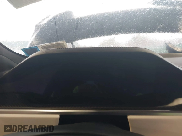 2022 Tesla Model S Plaid with VIN 5YJSA1E64NF477855, listed as a IAAI auction lot 41470591 with Not provided miles and . Bid and sale history available at DreamBid. Image 7.