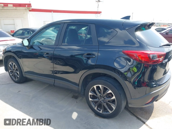 2016 Mazda CX-5 Grand Touring z VIN JM3KE2DY2G0765444, wystawiony jako IAAI lot #42527577 z przebiegiem 162 871 mil mil oraz . Historia ofert i sprzedaży dostępna na DreamBid. Obrazek 14.