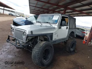 2006 Jeep Wrangler Sport with VIN 1J4FA49S46P748604, listed as a IAAI auction lot 41788157 with 128,249 mi miles. Bid and sale history available at carsss.com. Image 2.