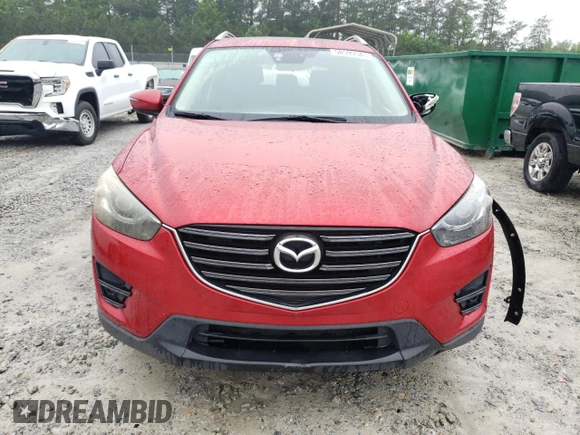 2016 Mazda CX-5 Grand Touring z VIN JM3KE2DY8G0623423, wystawiony jako Copart lot #58599545 z przebiegiem 131 932 mil mil oraz Szkoda całkowita • Salvage title. Historia ofert i sprzedaży dostępna na DreamBid. Obrazek 5.