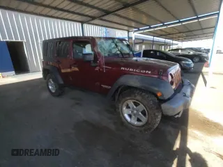 2010 Jeep Wrangler Unlimited Rubicon with VIN 1J4BA6H18AL197855, listed as a Copart auction lot 57748185 with 147,899 mi miles and Salvage title. Bid and sale history available at DreamBid. Image 13.