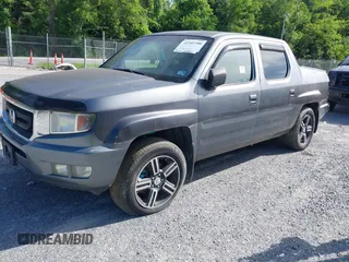 2009 Honda Ridgeline RTL with VIN 2HJYK16539H503533, listed as a IAAI auction lot 42307300 with 206,102 mi miles and . Bid and sale history available at DreamBid. Image 2.