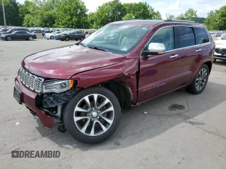 2017 Jeep Grand Cherokee Overland with VIN 1C4RJFCG5HC874130, listed as a Copart auction lot 65324695 with 101,588 mi miles and Salvage title. Bid and sale history available at DreamBid. Image 1.