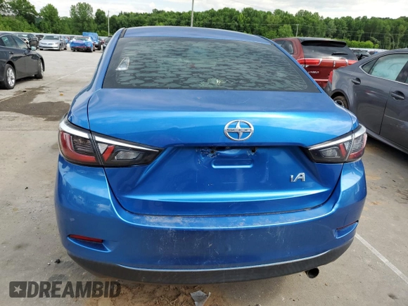 2016 Scion iA z VIN 3MYDLBZVXGY136365, wystawiony jako Copart lot #58978555 z przebiegiem 180 823 mil mil oraz Czysty tytuł • Clean title. Historia ofert i sprzedaży dostępna na DreamBid. Obrazek 6.