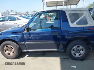 1997 Chevrolet Tracker z VIN 2CNBE1865V6926154, wystawiony jako IAAI lot #42207157 z przebiegiem 176 104 mil mil oraz . Historia ofert i sprzedaży dostępna na DreamBid. Obrazek 14.