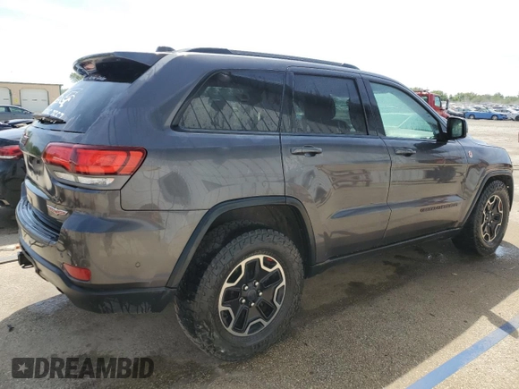 2017 Jeep Grand Cherokee Trailhawk with VIN 1C4RJFLGXHC654112, listed as a Copart auction lot 56397195 with 168,136 mi miles and Salvage title. Bid and sale history available at DreamBid. Image 3.