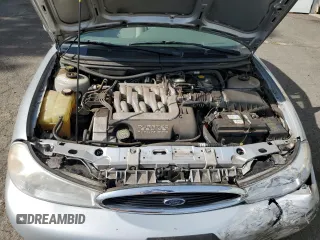 1998 Ford Contour LX with VIN 1FAFP66L2WK290948, listed as a Copart auction lot 56204295 with 76,307 mi miles and Salvage title. Bid and sale history available at DreamBid. Image 11.
