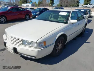 1996 Cadillac Seville Touring STS with VIN 1G6KY5298TU815539, listed as a IAAI auction lot 41665242 with 151,736 mi miles. Bid and sale history available at carsss.com. Image 2.