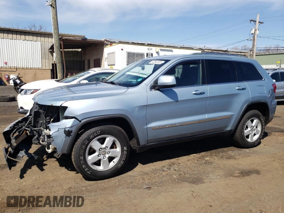 2012 Jeep Grand Cherokee Laredo with VIN 1C4RJFAG5CC222569, listed as a Copart auction lot 53264185 with 153,921 mi miles and Salvage Title. Bid and sale history available at carsss.com. Image 1.