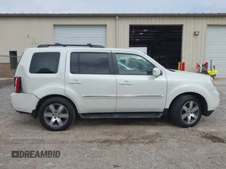2014 Honda Pilot Touring with VIN 5FNYF4H93EB023602, listed as a IAAI auction lot 41909653 with 162,118 mi miles and . Bid and sale history available at carsss.com. Image 13.