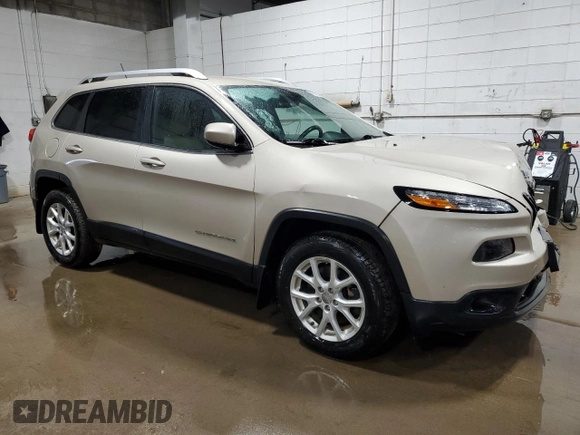 2015 Jeep Cherokee Latitude with VIN 1C4PJMCS1FW601438, listed as a Copart auction lot 48332875 with 135,380 mi miles and Salvage Title. Bid and sale history available at DreamBid. Image 4.