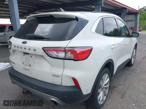 2021 Ford Escape Titanium with VIN 1FMCU9J93MUA36648, listed as a IAAI auction lot 42055229 with 122,864 mi miles and . Bid and sale history available at carsss.com. Image 4.