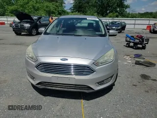2015 Ford Focus Titanium with VIN 1FADP3J27FL267339, listed as a Copart auction lot 63395835 with 73,372 mi miles and Salvage title. Bid and sale history available at DreamBid. Image 13.