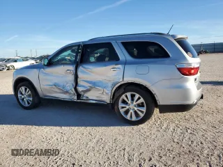 2013 Dodge Durango Crew with VIN 1C4SDHDT0DC590172, listed as a Copart auction lot 80140034 with 135,078 mi miles and Salvage title. Bid and sale history available at DreamBid. Image 2.