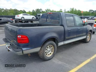 2003 Ford F-150 XLT with VIN 1FTRW076X3KC61967, listed as a IAAI auction lot 42016065 with 206,256 mi miles. Bid and sale history available at carsss.com. Image 4.