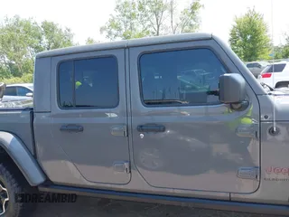 2021 Jeep Gladiator Rubicon with VIN 1C6JJTBG2ML515932, listed as a IAAI auction lot 42471704 with 57,775 mi miles and . Bid and sale history available at DreamBid. Image 14.