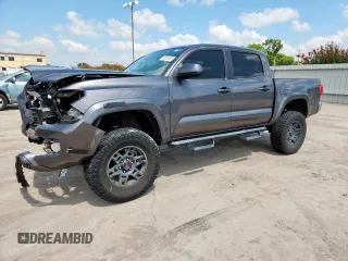 2017 Toyota Tacoma SR5 with VIN 5TFAZ5CNXHX026008, listed as a Copart auction lot 65030335 with 105,220 mi miles and Salvage title. Bid and sale history available at DreamBid. Image 1.