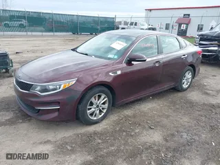 2016 Kia Optima LX with VIN 5XXGT4L36GG108599, listed as a IAAI auction lot 42065639 with 127,387 mi miles. Bid and sale history available at carsss.com. Image 2.