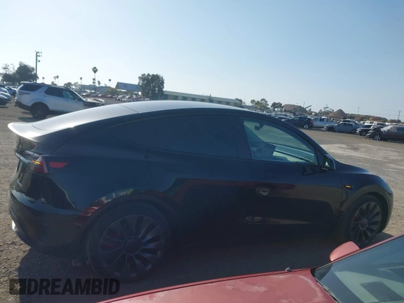 2023 Tesla Model Y Performance with VIN 7SAYGDEF4PF809308, listed as a IAAI auction lot 42056769 with 12,101 mi miles and . Bid and sale history available at DreamBid. Image 12.