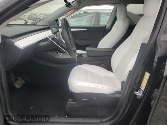 2023 Tesla Model Y Long Range with VIN 7SAYGAEE0PF642810, listed as a Copart auction lot 52181655 with 74,922 mi miles and Salvage Title. Bid and sale history available at DreamBid. Image 7.