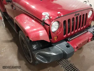 2012 Jeep Wrangler Unlimited Sahara with VIN 1C4BJWEG0CL256852, listed as a IAAI auction lot 41765640 with 171,408 mi miles. Bid and sale history available at carsss.com. Image 6.
