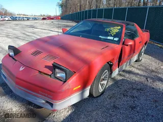 1985 Pontiac Firebird Trans Am with VIN 1G2FW87H3FN208733, listed as a IAAI auction lot 41705988 with 87,906 mi miles. Bid and sale history available at carsss.com. Image 2.