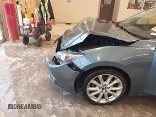 2014 Mazda 3 S Grand Touring with VIN JM1BM1W31E1182703, listed as a IAAI auction lot 41470742 with 123,956 mi miles and . Bid and sale history available at DreamBid. Image 18.