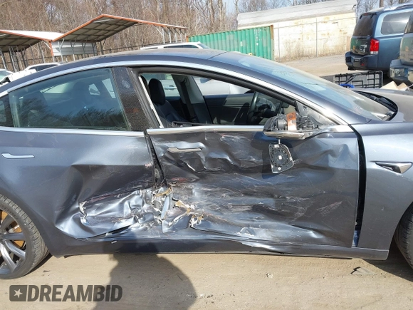 2018 Tesla Model 3 Long Range Battery with VIN 5YJ3E1EB5JF063077, listed as a IAAI auction lot 41773551 with 99,477 mi miles and . Bid and sale history available at DreamBid. Image 6.
