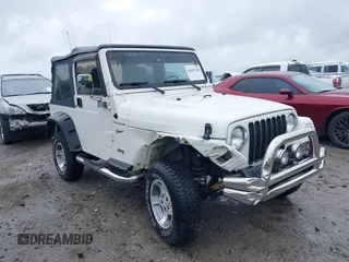 2002 Jeep Wrangler Sport with VIN 1J4FA49S12P774975, listed as a IAAI auction lot 42431740 with 215,908 mi miles and . Bid and sale history available at DreamBid. Image 1.