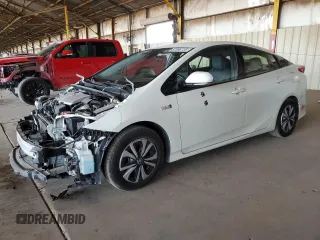 2017 Toyota Prius Plus z VIN JTDKARFP9H3028985, wystawiony jako Copart lot #57596735 z przebiegiem 89 031 mil mil oraz Szkody całkowita. Historia ofert i sprzedaży dostępna na DreamBid. Obrazek 1.
