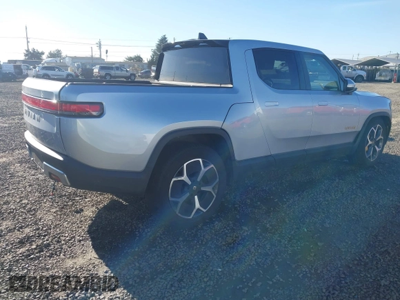 2023 Rivian R1T Adventure with VIN 7FCTGAAA0PN021864, listed as a IAAI auction lot 41620630 with 1 mi miles. Bid and sale history available at carsss.com. Image 4.