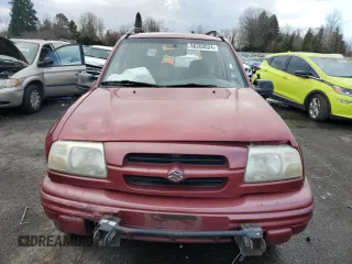 2000 Suzuki Vitara JX z VIN 2S3TD52V9Y6100173, wystawiony jako Copart lot #86200824 z przebiegiem Nie podano mil oraz Szkody całkowita. Historia ofert i sprzedaży dostępna na DreamBid. Obrazek 5.