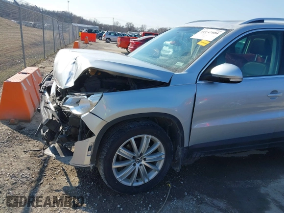 2011 Volkswagen Tiguan SE with VIN WVGBV7AX2BW562055, listed as a IAAI auction lot 41642084 with 175,407 mi miles and . Bid and sale history available at DreamBid. Image 18.